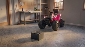 image of kids atv in garage with battery