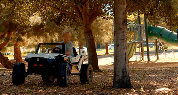 kid safely riding ride on toy outside